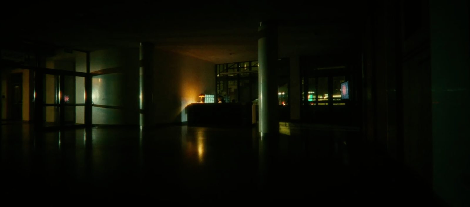 Night interior lit by practicals, wide
