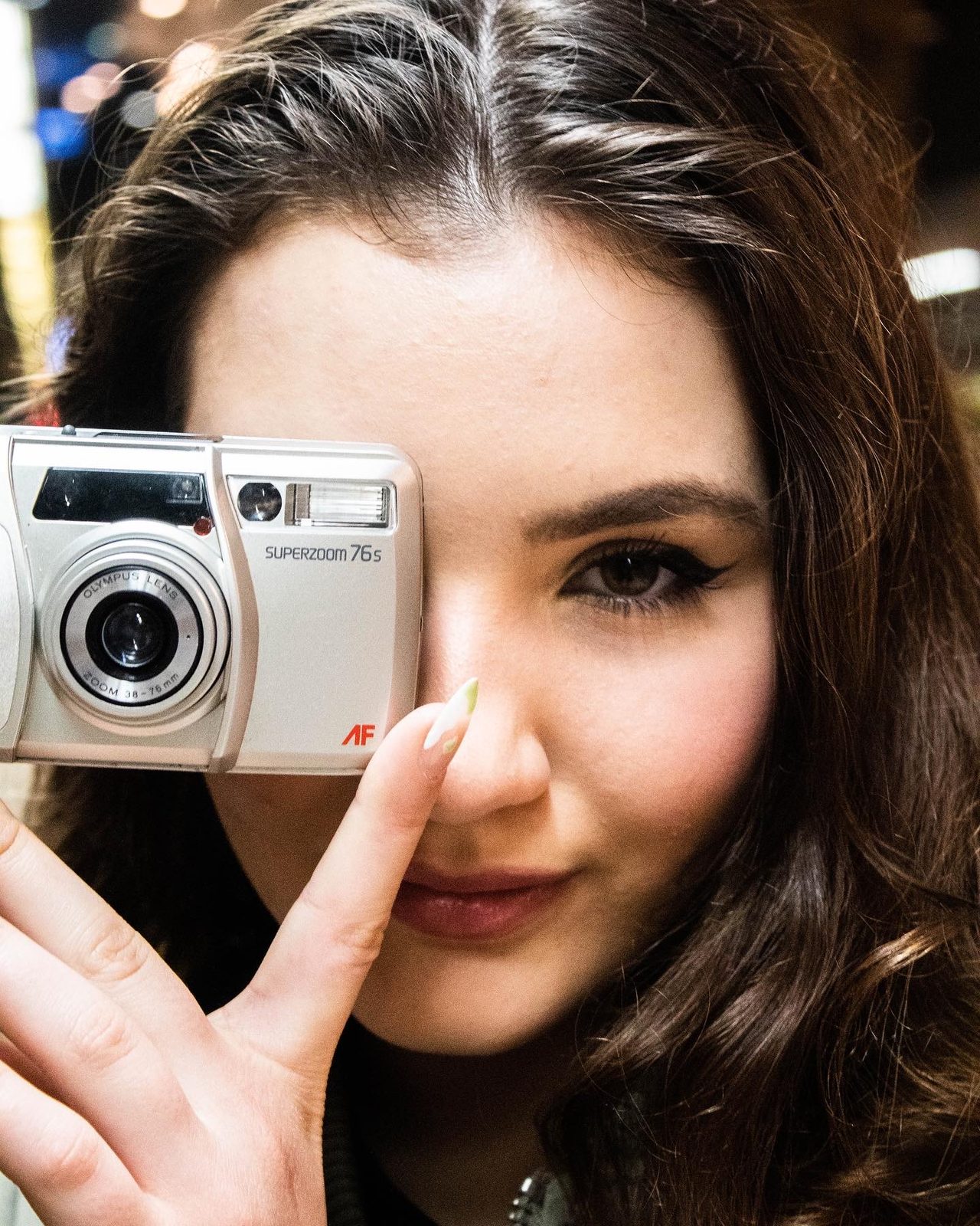 Close portrait with film camera